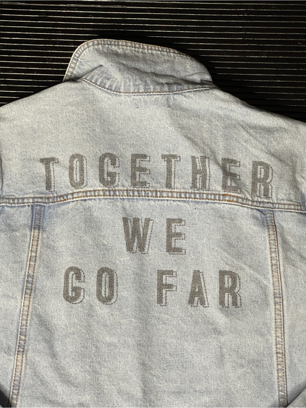 Peloton Light Blue Denim Jacket with 'TOGETHER WE GO FAR' Back Graphic